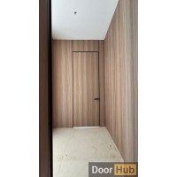 Natural Veneer Interior Door with Royal Black Anodized Profile – Developer Supply UAE